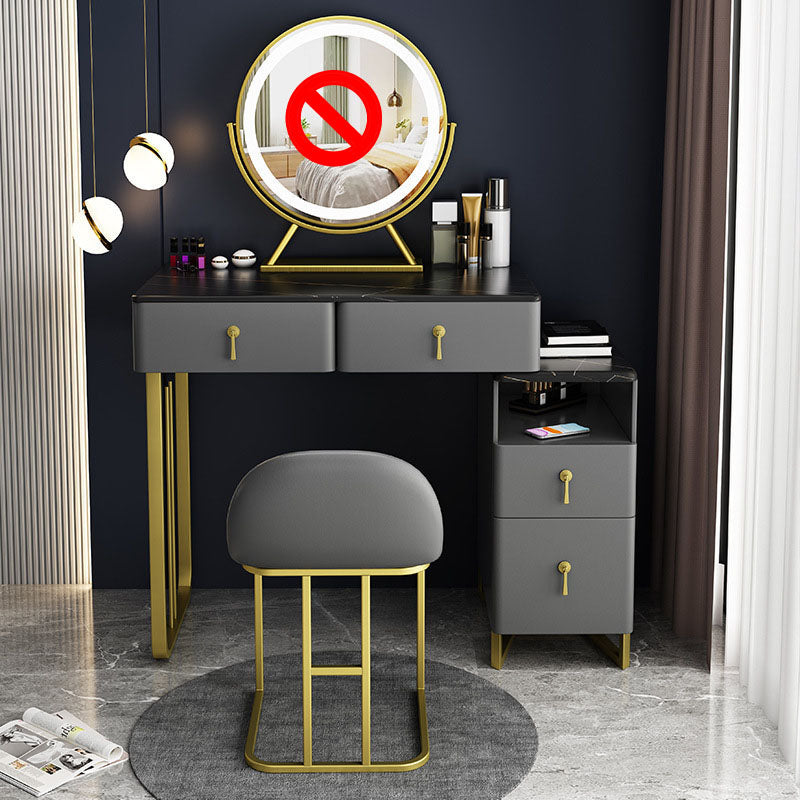 Tavolo da vanità glam con 4 cassetti e base dorata e top in pietra