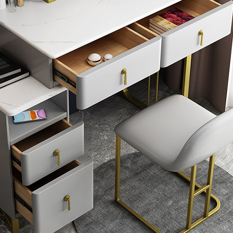 Tavolo da vanità glam con 4 cassetti e base dorata e top in pietra
