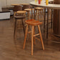 Taburete de bar de madera sin respaldo moderno con pedal y asiento de madera