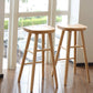 Taburete de bar de madera sin respaldo moderno con pedal y asiento de madera