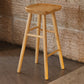 Taburete de bar de madera sin respaldo moderno con pedal y asiento de madera