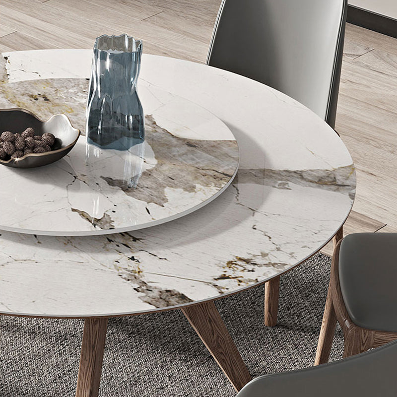 Witte gesinterde stenen tafel rond huiskeukendiner met natuurlijke poten