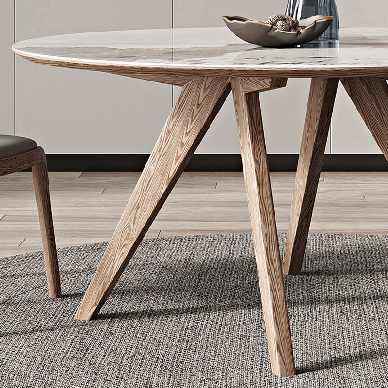 Witte gesinterde stenen tafel rond huiskeukendiner met natuurlijke poten