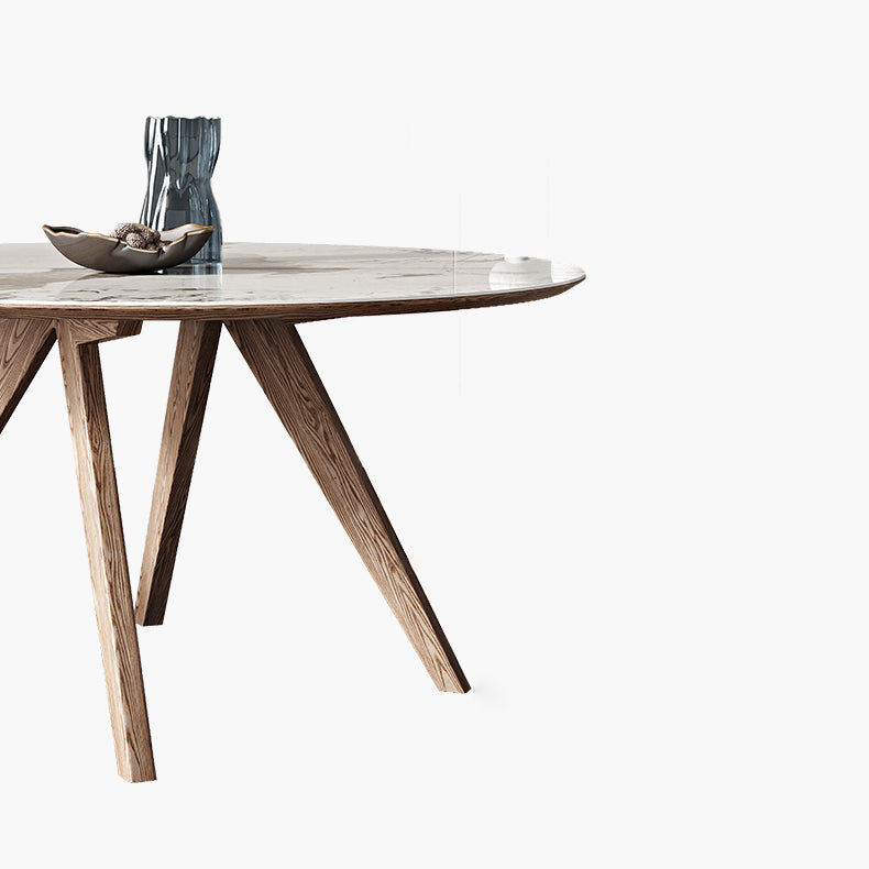 Witte gesinterde stenen tafel rond huiskeukendiner met natuurlijke poten
