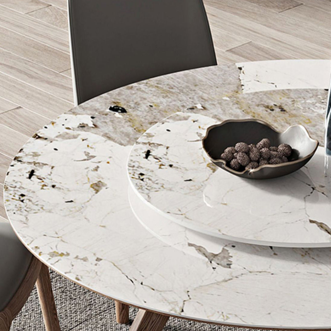 Witte gesinterde stenen tafel rond huiskeukendiner met natuurlijke poten