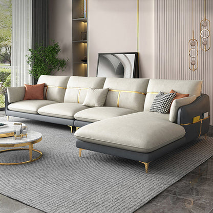 Divano sezionale in vetro in finta in finta pelle grigio a forma di l braccio inclinata