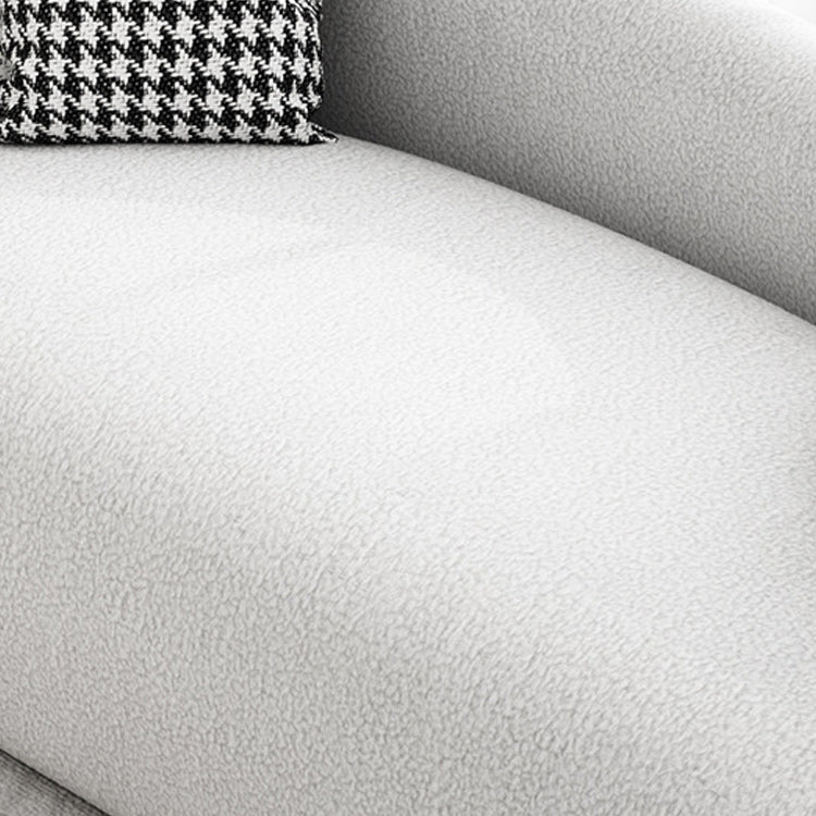 Canapé incurvé moderne dans un canapé de bras en pente en laine blanche avec oreillers