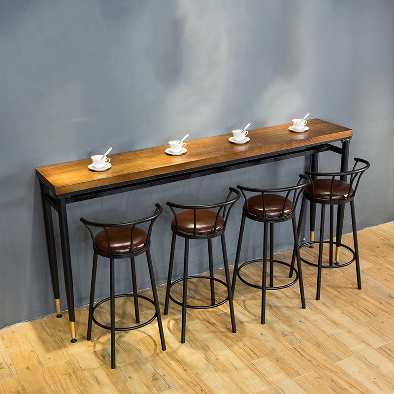 Table à hauteur de bar avec plateau en bois, pieds noirs et base en métal