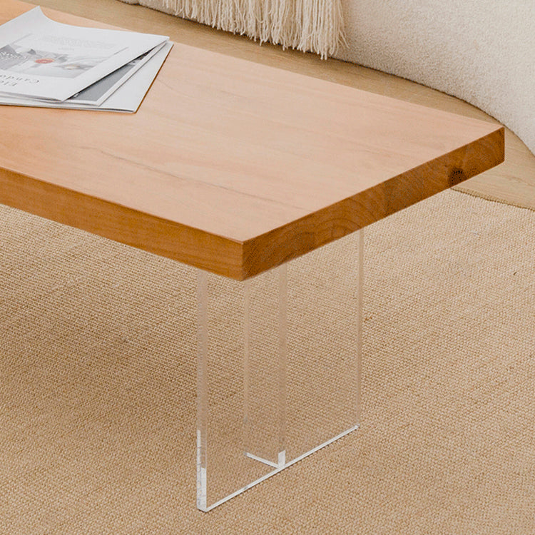 Table basse scandinave avec plateau en bois massif et base en acrylique