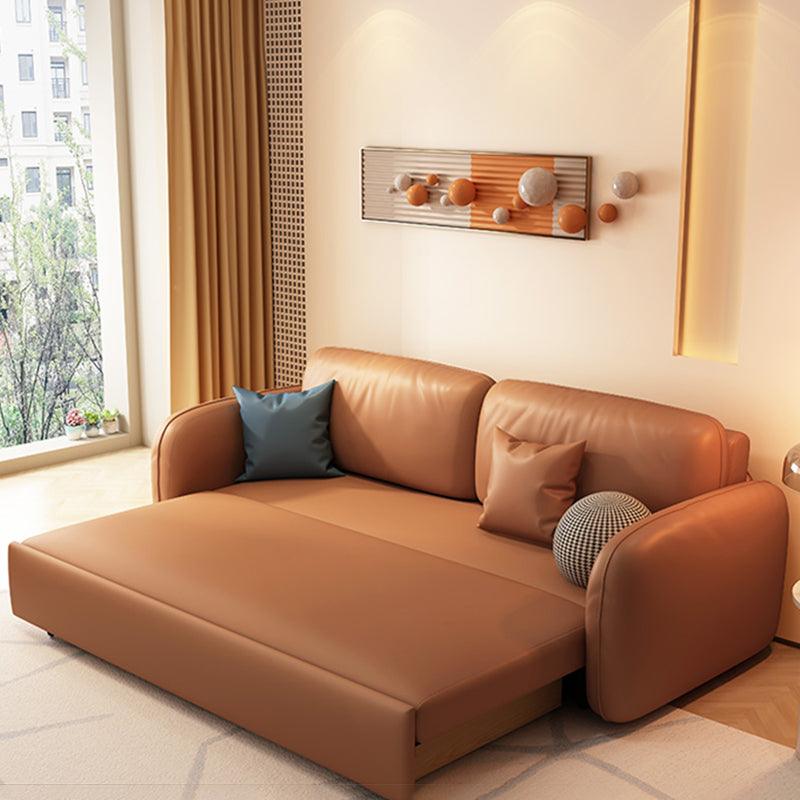 茶色の枕付きフェイクレザーソファー