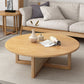 Tavolino scandinavo rotondo con gambe incrociate in legno di pino