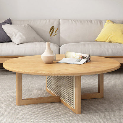 Tavolino scandinavo rotondo con gambe incrociate in legno di pino