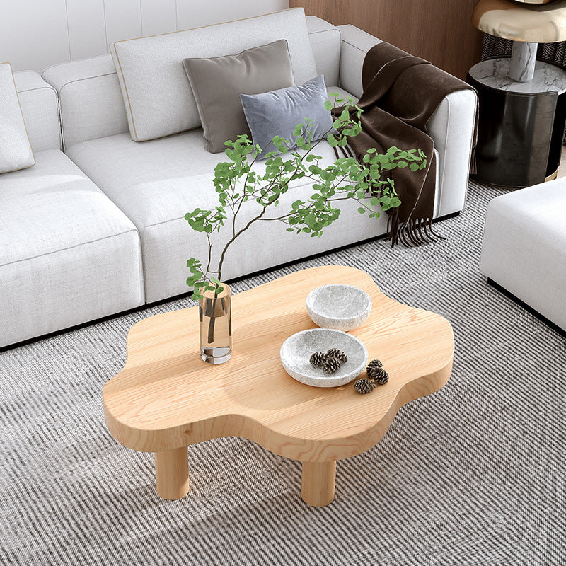 Table basse scandinave de forme libre avec 3 pieds en bois de pin