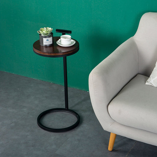 Tavolo marrone rotondo in legno da 27,55 pollici.