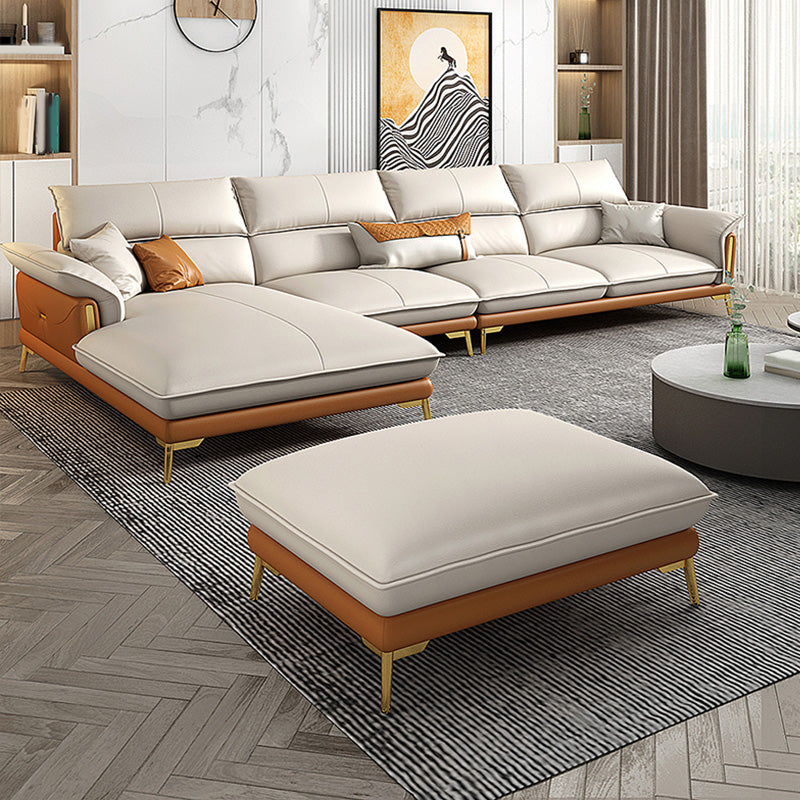Glam lederen woonkamer zitplaatsen wijd uitlopende armkussens witte bank