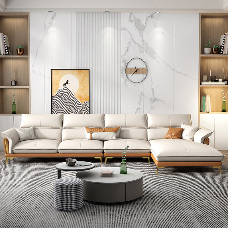 Glam lederen woonkamer zitplaatsen wijd uitlopende armkussens witte bank