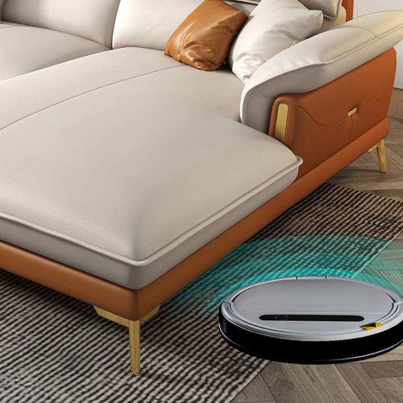 Glam lederen woonkamer zitplaatsen wijd uitlopende armkussens witte bank