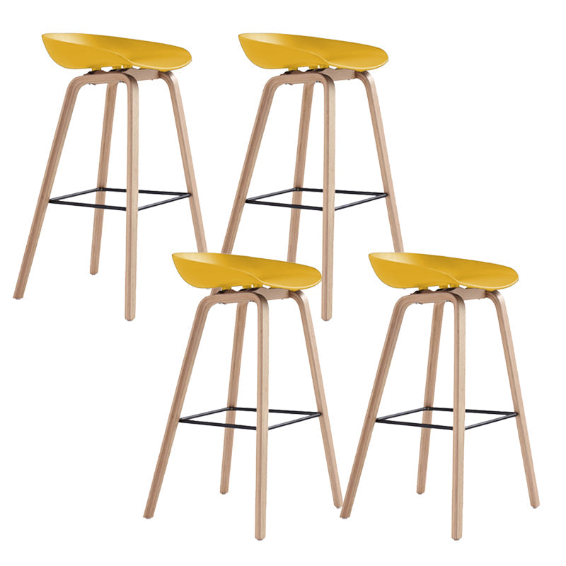Indoor Plastic Bucket Seat Scandinavian Armless Bar Height Stool with Wood Legs Yellow 4 Piece Set Clearhalo 'Bar Furniture' 'Bar Stools' 'bar_stools' 'furn' 'furn_bar_stools' 'Furniture' 'Kitchen & Dining Furniture' 6556333