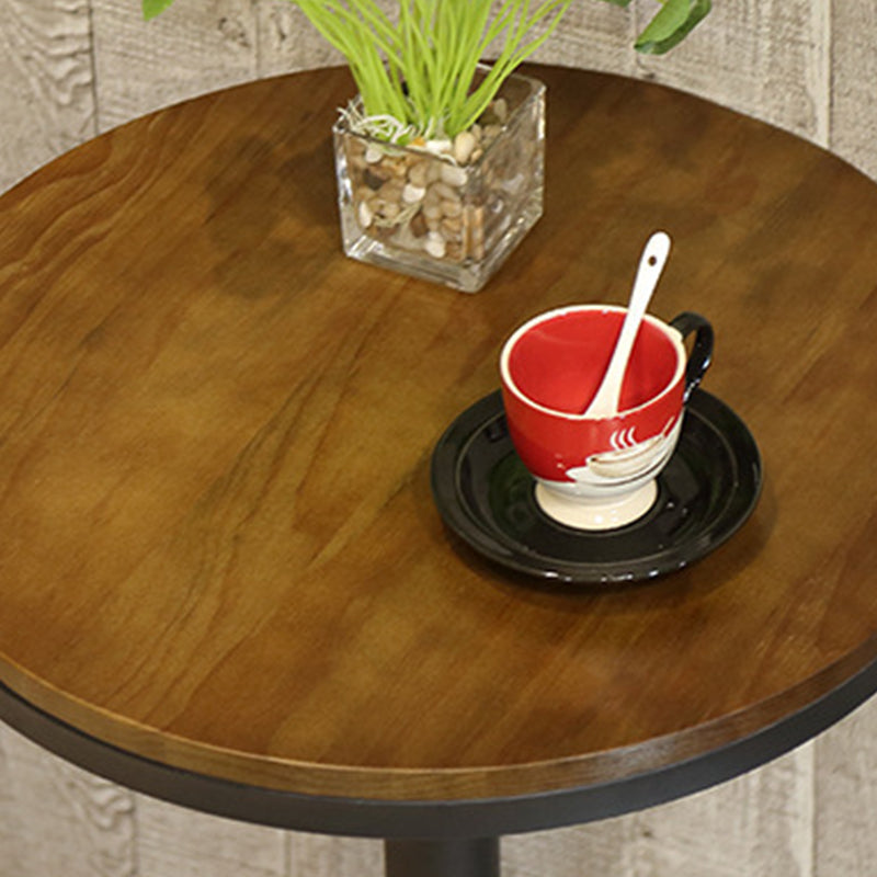 Industrieller Bistro-Stehtisch mit Sockel aus massivem Holz und Metall