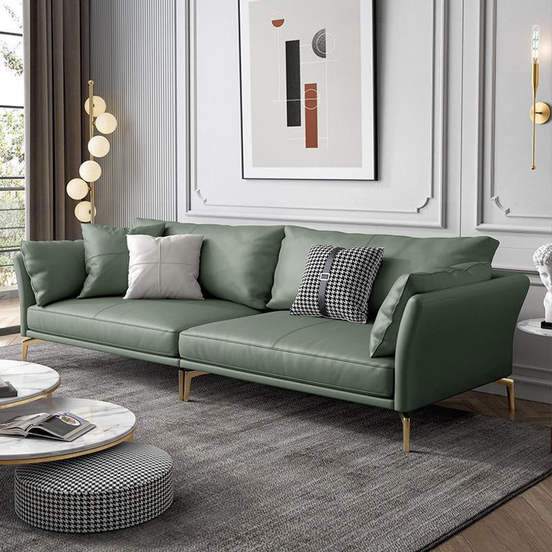 Sofá de brazo acampanado de cuero genuino lujoso sofá verde con almohadas