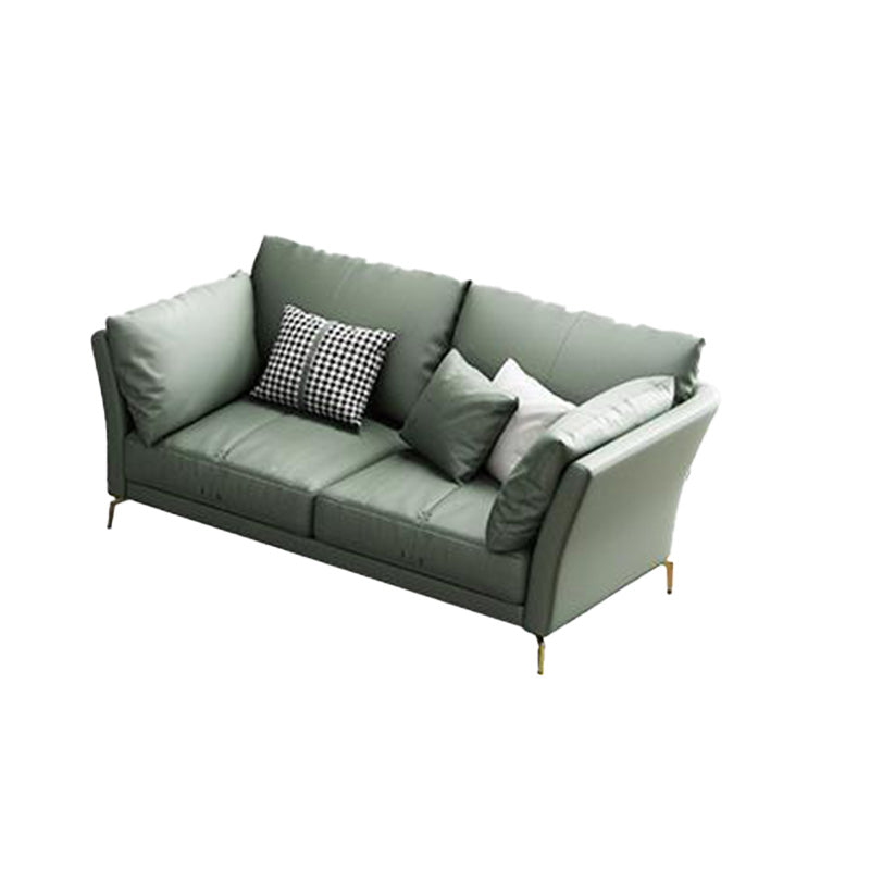 Sofá de brazo acampanado de cuero genuino lujoso sofá verde con almohadas