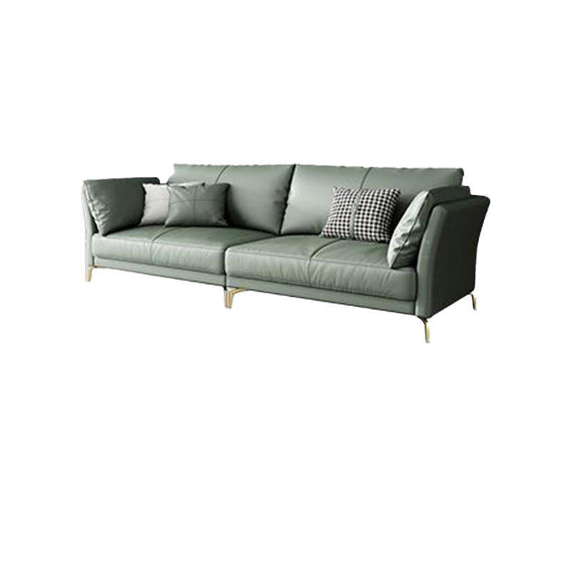 Sofá de brazo acampanado de cuero genuino lujoso sofá verde con almohadas