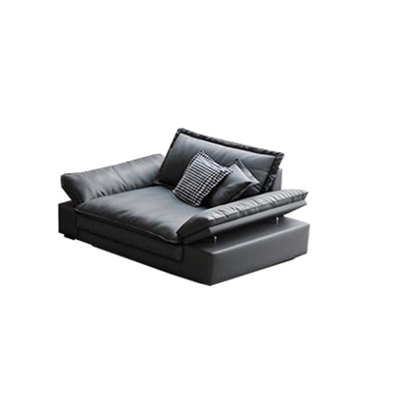 Canapé noir moderne du milieu du siècle avec un bras toret et dos lâche