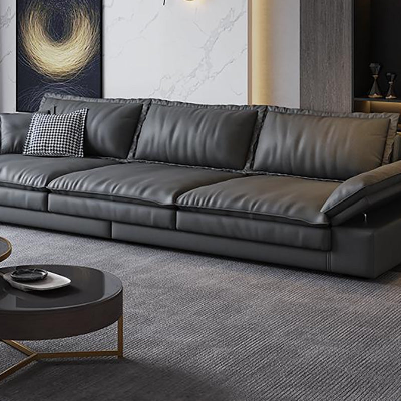 Canapé noir moderne du milieu du siècle avec un bras toret et dos lâche