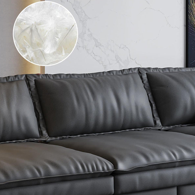 Canapé noir moderne du milieu du siècle avec un bras toret et dos lâche