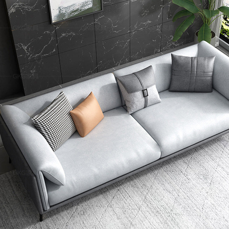 Kissen -Oberarm -Sofa mit Kissen, die zeitgenössisch in Grau sitzen