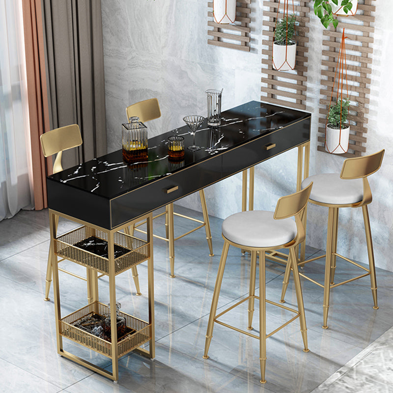 Bistro-bartafel van gesinterd steen, onderstel met goudkleurig frame en lades