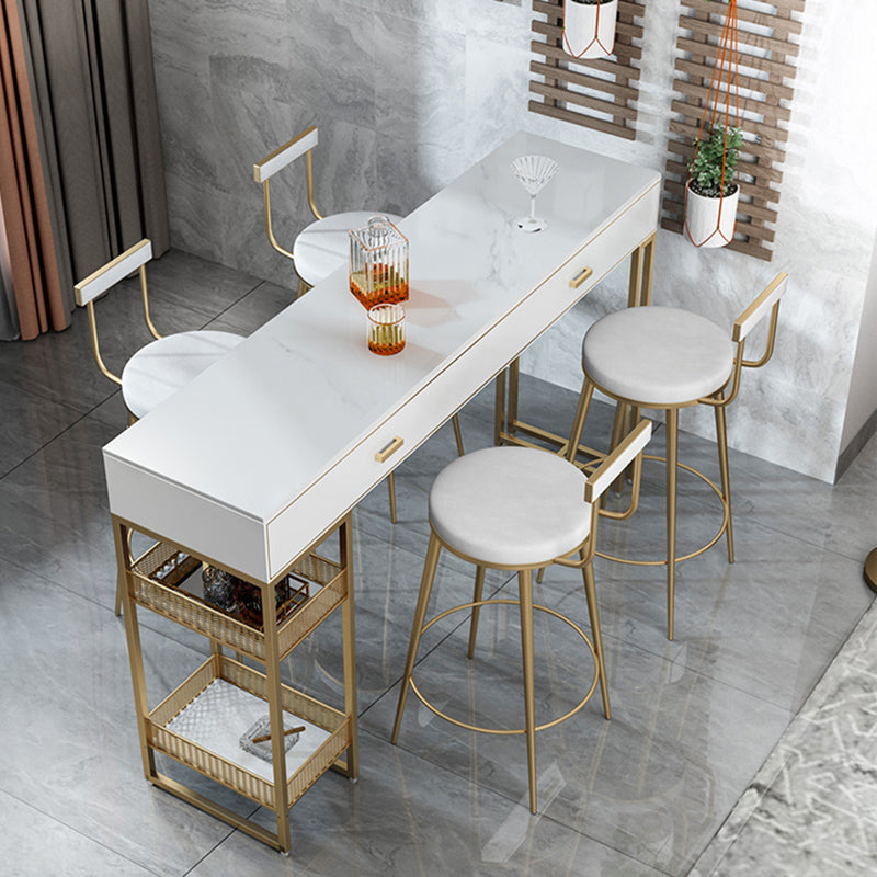 Bistro-bartafel van gesinterd steen, onderstel met goudkleurig frame en lades