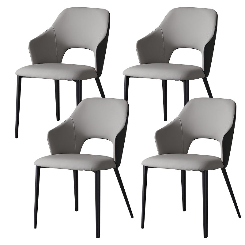 Eigentijdse kunstleren eetkamerstoelen met zwarte poten en fauteuil