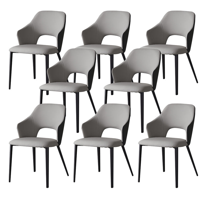 Eigentijdse kunstleren eetkamerstoelen met zwarte poten en fauteuil