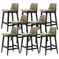 Taburete de bar de cuero con respaldo para mostrador Bristol con patas de madera