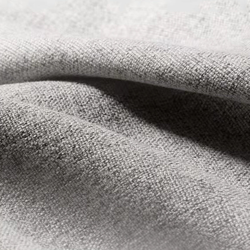 Sleeper de tela moderna en un futón de brazo acampanado gris claro y colchón con almacenamiento