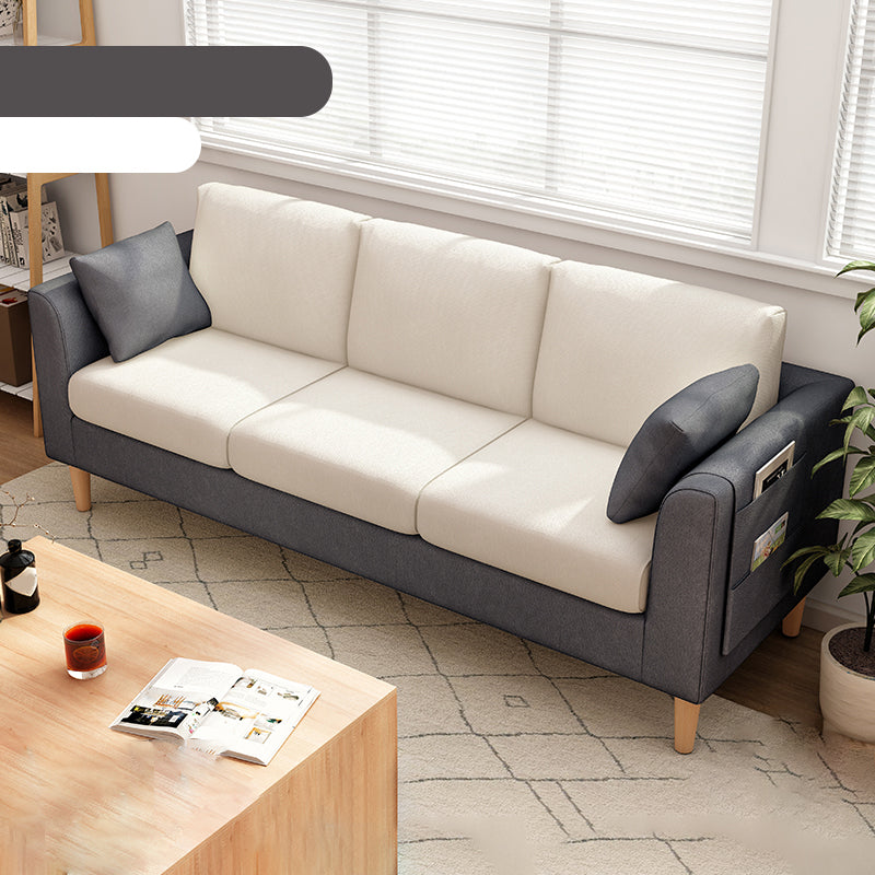 Canapé scandinave de 3 places avec oreillers en dos et bras de smoking et pattes en bois massif