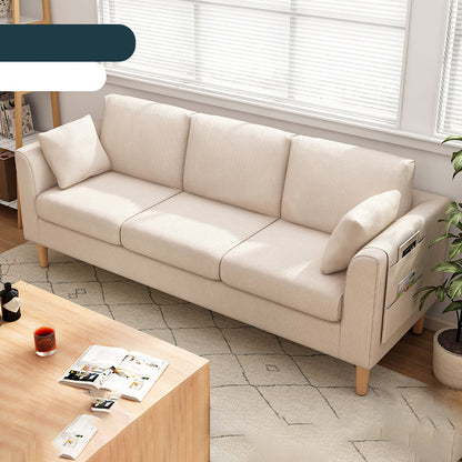 Canapé scandinave de 3 places avec oreillers en dos et bras de smoking et pattes en bois massif