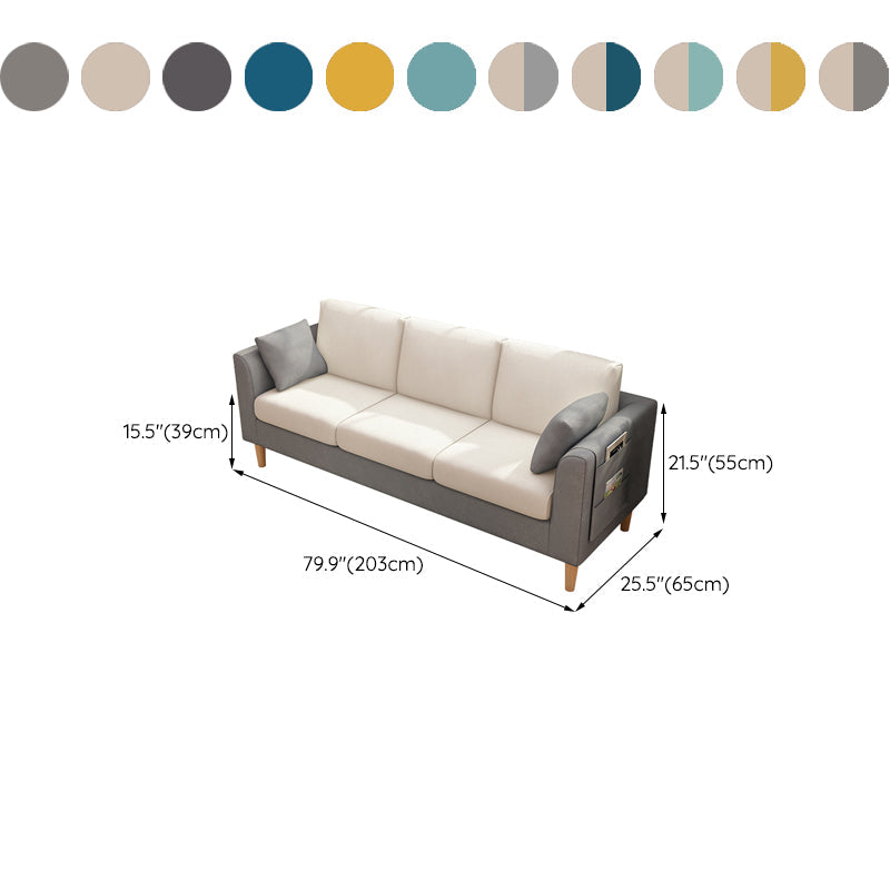 Canapé scandinave de 3 places avec oreillers en dos et bras de smoking et pattes en bois massif