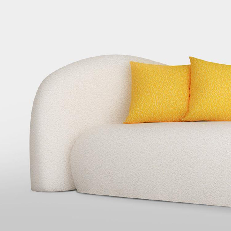 Divano beige e grigio scuro smoking a sedere con cuscini per l'appartamento