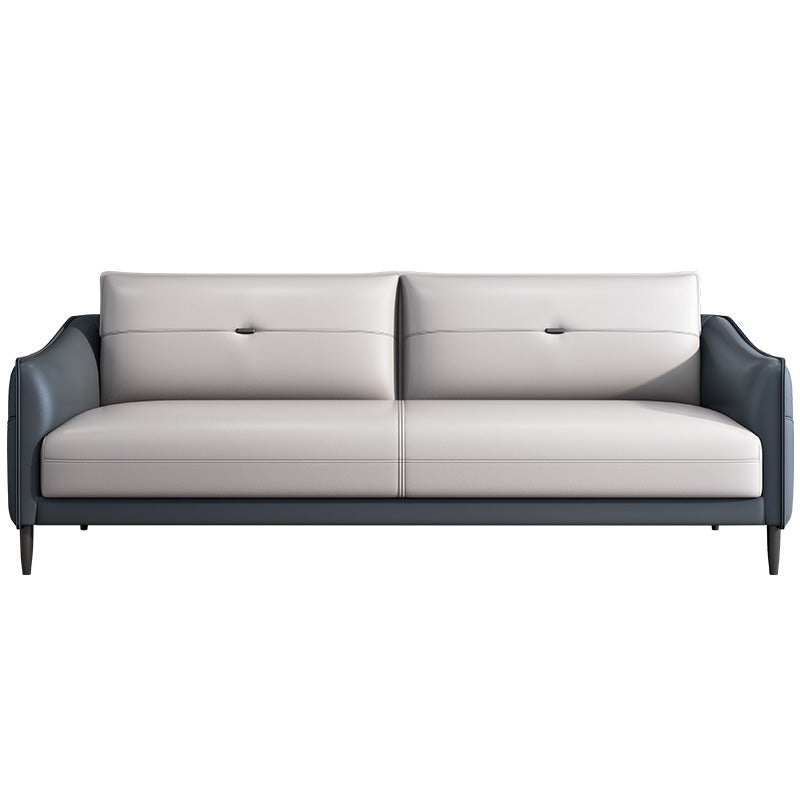 Sofá de cuero gris con cuatro patas sueltas de estilo nórdico de espalda