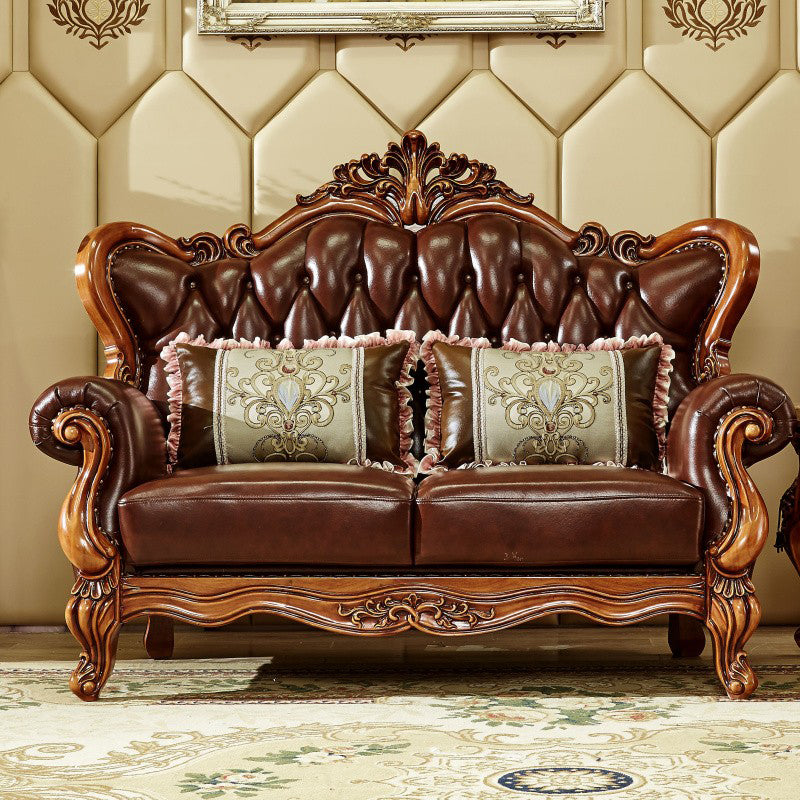 Sofá de brazo acampanado con asiento dividido tradicional con mechones adornados con almohadas en marrón