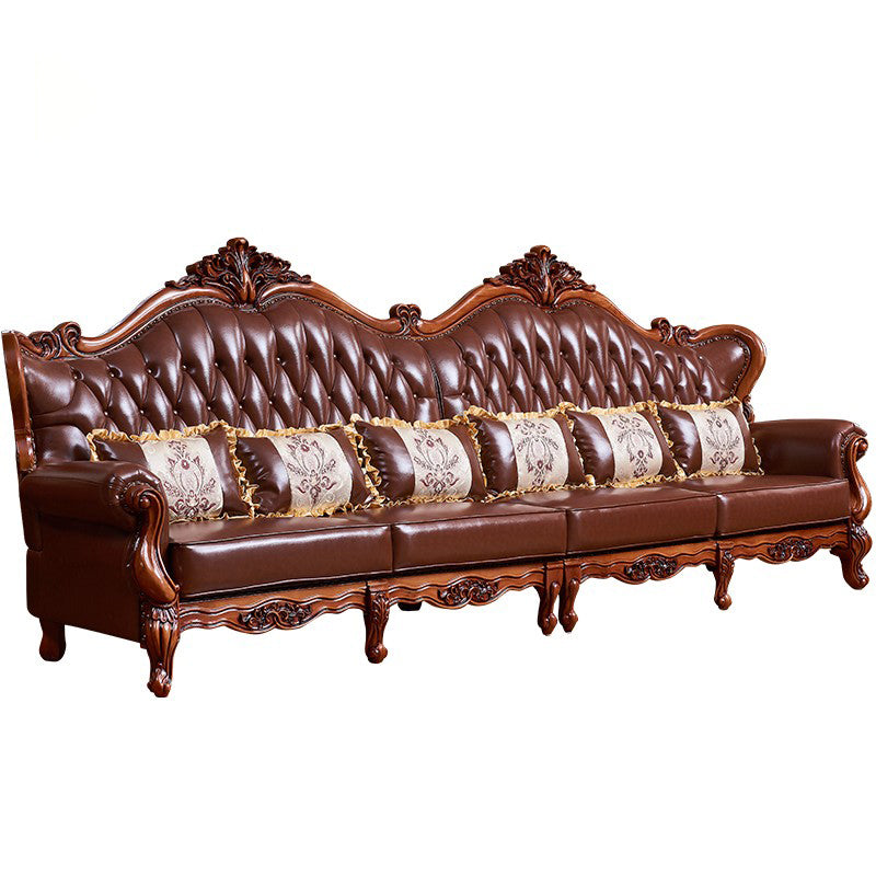 Sofá de brazo acampanado con asiento dividido tradicional con mechones adornados con almohadas en marrón