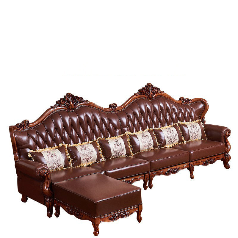 Sofá de brazo acampanado con asiento dividido tradicional con mechones adornados con almohadas en marrón