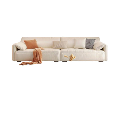 Sofá seccional con brazo superior tipo almohada en madera maciza con respaldo acolchado