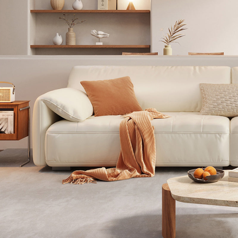 Sofá seccional con brazo superior tipo almohada en madera maciza con respaldo acolchado