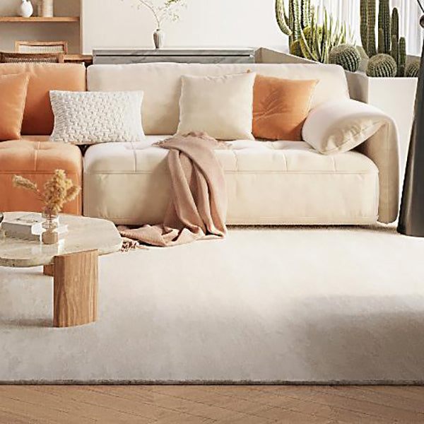 Sofá seccional con brazo superior tipo almohada en madera maciza con respaldo acolchado