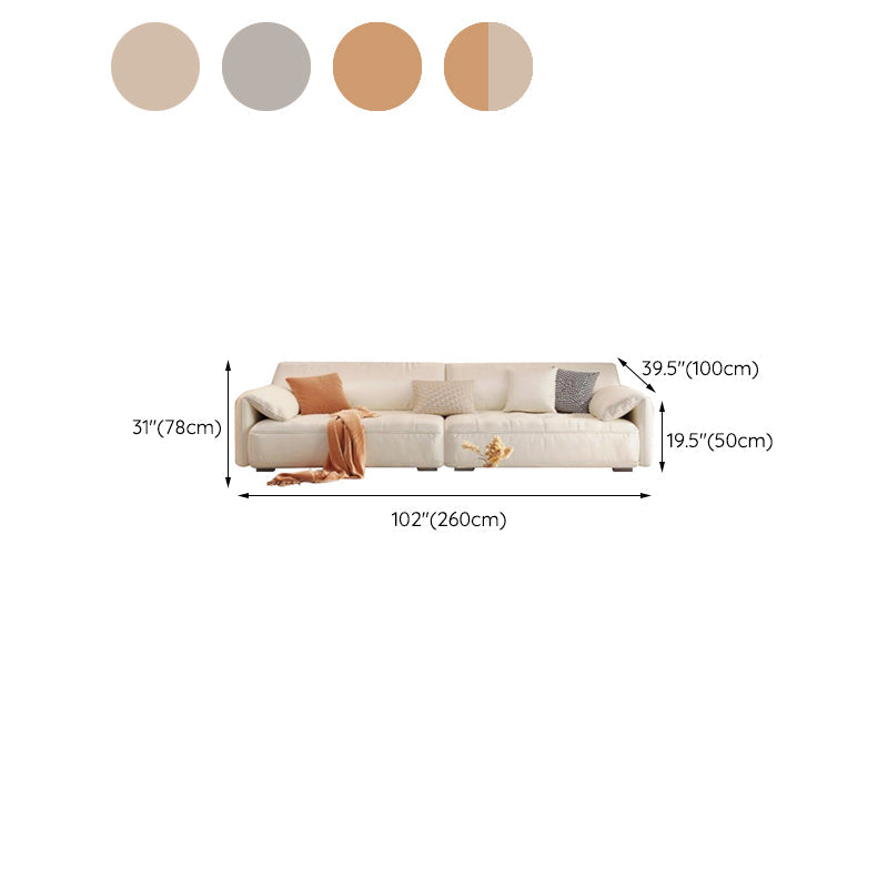 Sofá seccional con brazo superior tipo almohada en madera maciza con respaldo acolchado