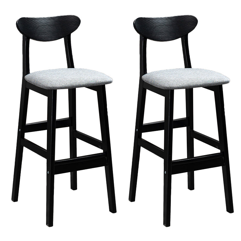 Sgabelli da bar imbottiti da bar in legno solido industriale con gambe nere