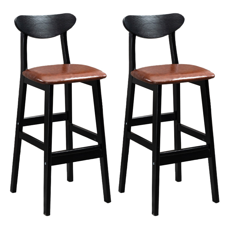 Sgabelli da bar imbottiti da bar in legno solido industriale con gambe nere